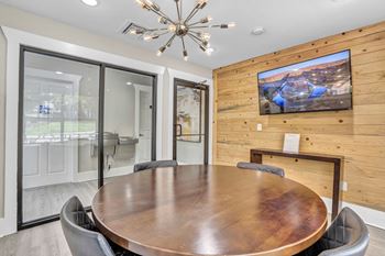 a conference room with a large table and a tv on the wall at Sunset Ridge, San Antonio, 78209