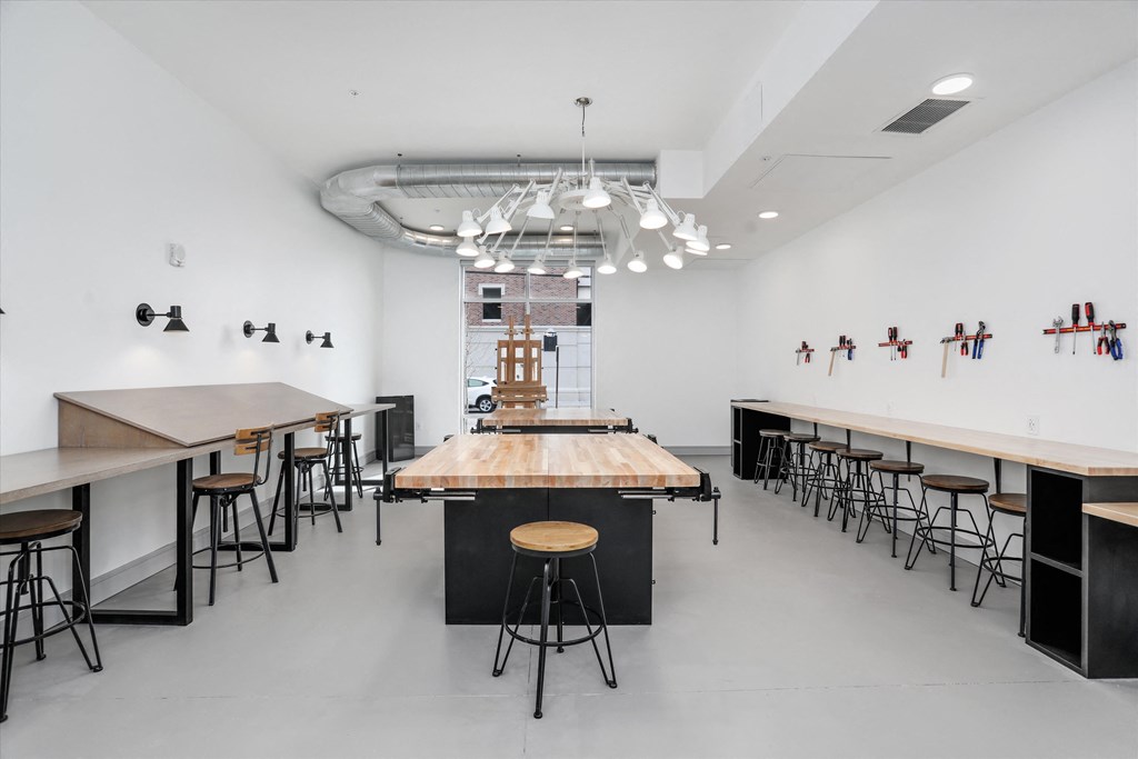 a large room with tables and chairs and a bar in the middle at Beekman on Broadway, Ann Arbor, MI, 48105