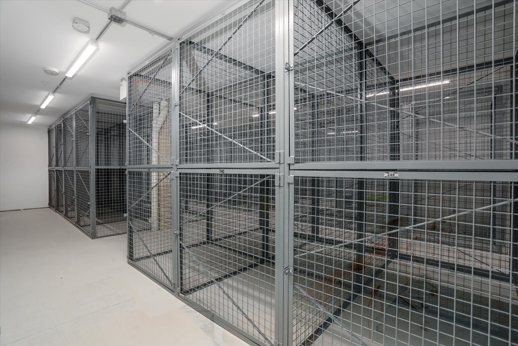 the inside of a prison cell with metal cages at Beekman on Broadway, Ann Arbor