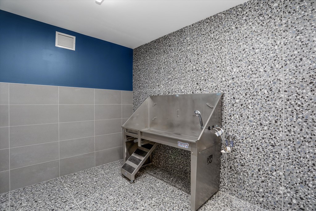 a bathroom with a sink and a urinal in it at Beekman on Broadway, Michigan, 48105