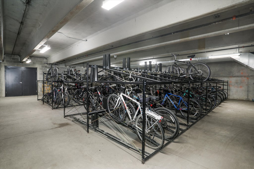 a rack full of bikes in a parking garage at Beekman on Broadway, Ann Arbor, Michigan