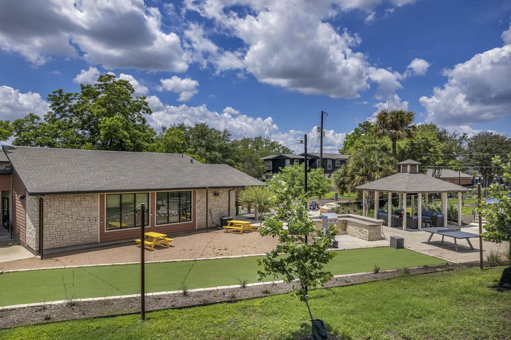 a backyard with a grassy area and a gazebo  at Sunset Ridge, Texas