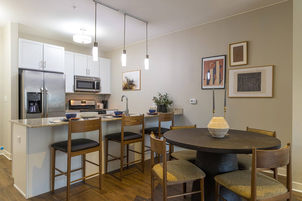 a kitchen and dining area in a 555 waverly unit  at Elmhurst 255, Elmhurst, IL, 60126