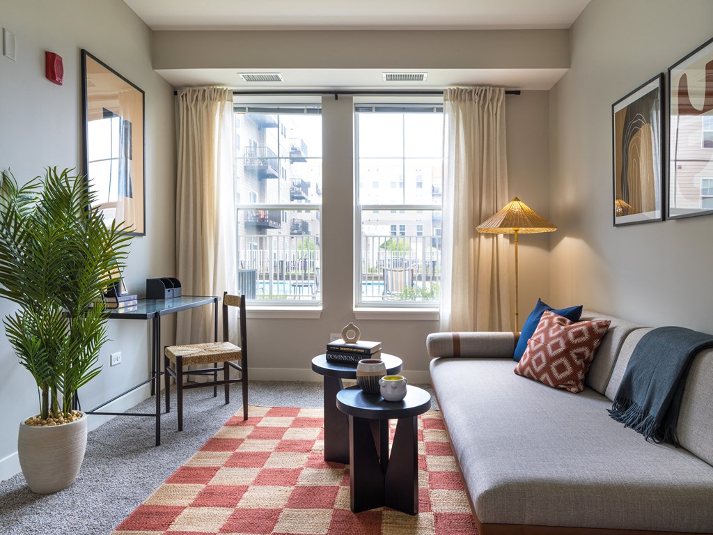 a living area with a couch coffee table and two windows  at Elmhurst 255, Illinois, 60126