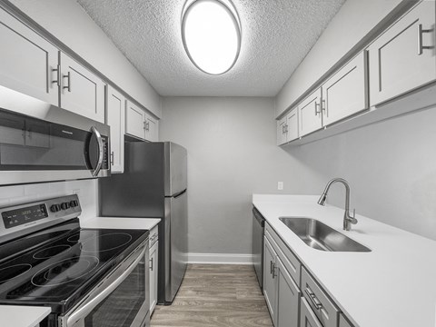 Apartment kitchen with stainless steel appliances