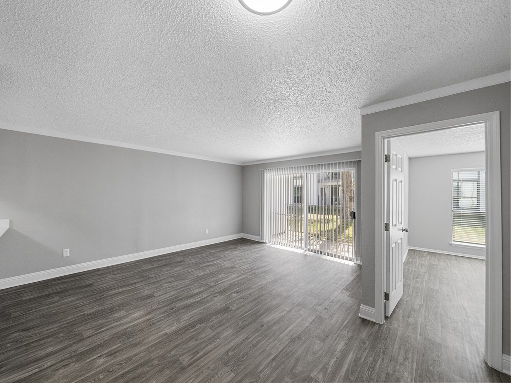 Unfurnished living room with patio at The Stella, Irving, Texas