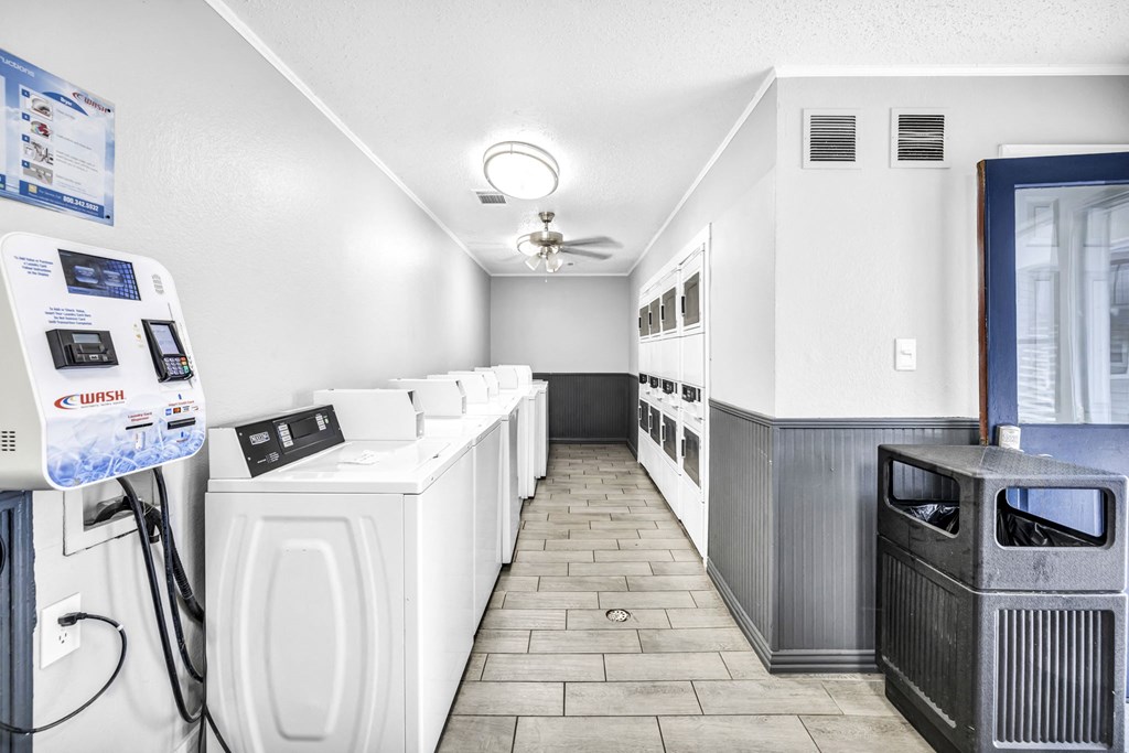 a laundry room with a bunch of machines in it