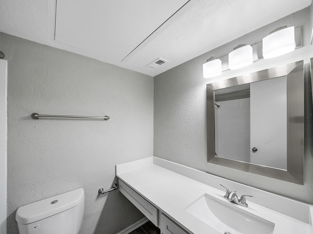 Bathroom with sink, toilet and mirror at The Stella, Texas