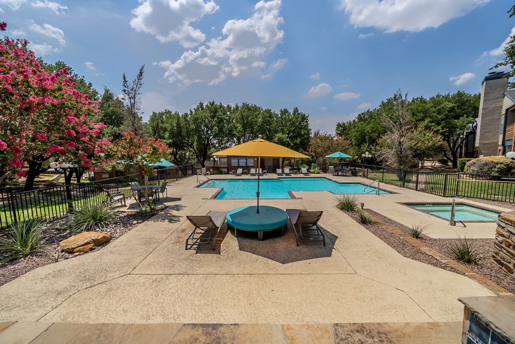 Relaxing chairs with Umbrella at Trinity Apartments, Texas, 75061