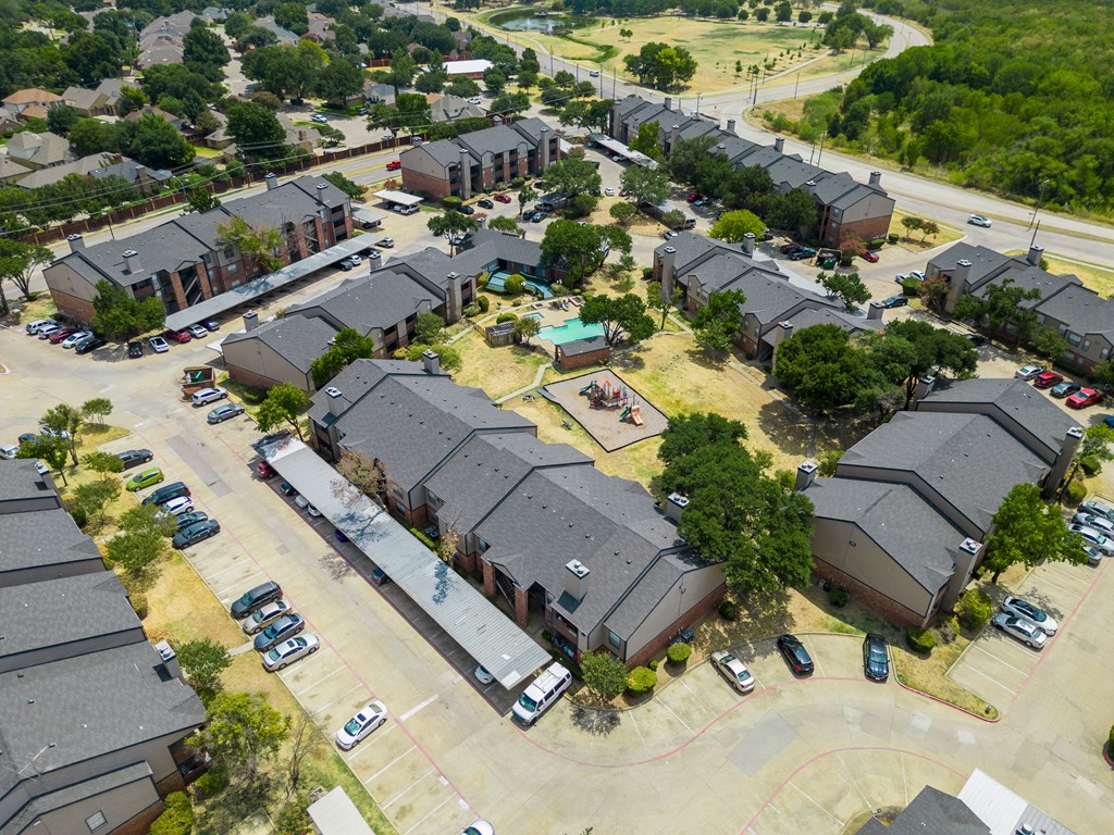 Aerial view of the property and neighborhood at Trinity Apartments, Irving, TX, 75061