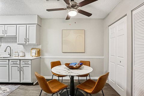 Dining room with round table at The Grove Brentwood, Tennessee