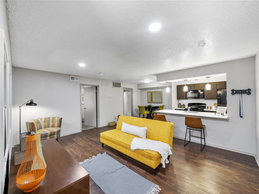 Living room with couch at Trinity Apartments, Irving, Texas
