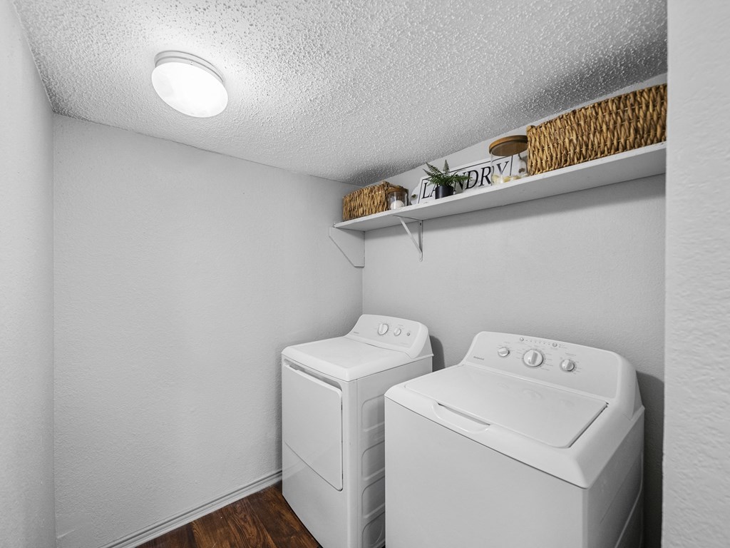 Laundry room at Trinity Apartments, Irving, 75061