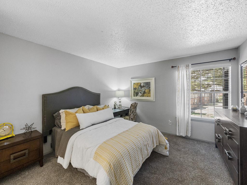 Bedroom with a large bed at Trinity Apartments, Irving