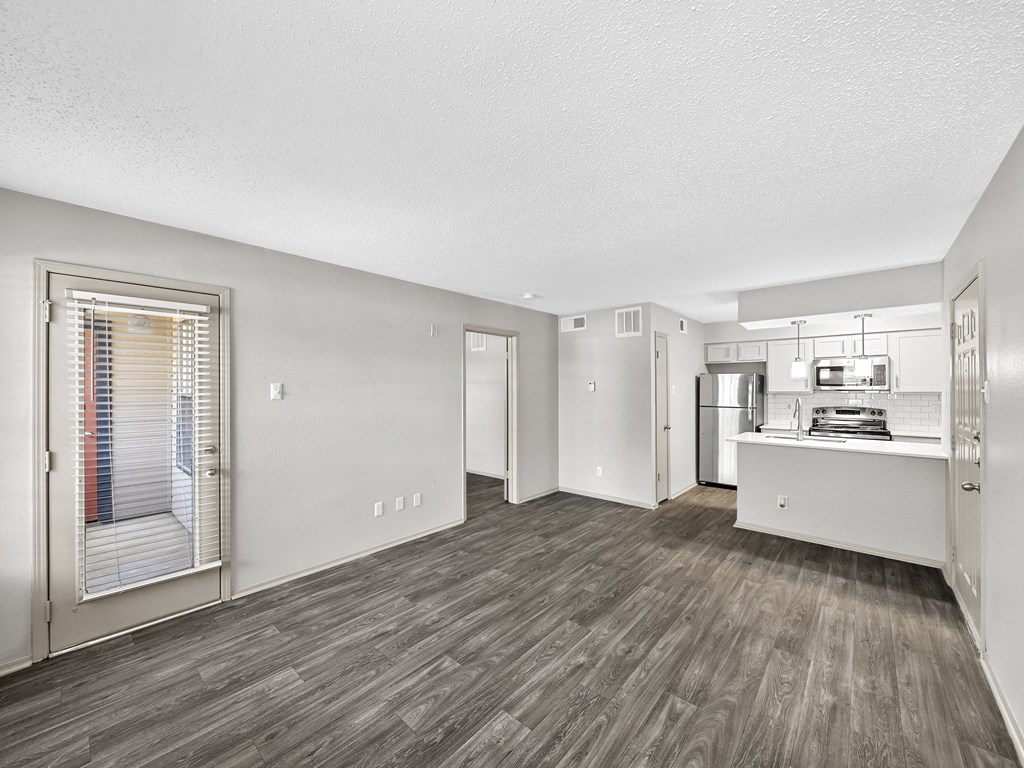 Kitchen and living room at Trinity Apartments, Irving, Texas