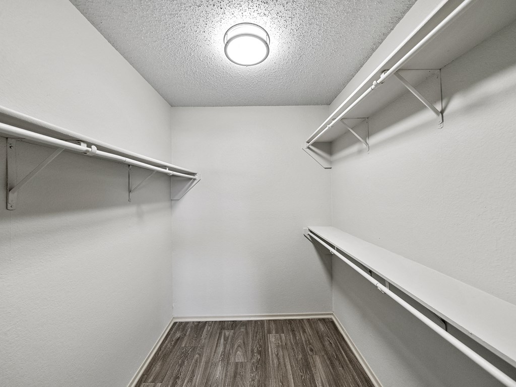 Spacious walk in closet at Trinity Apartments, Irving, Texas