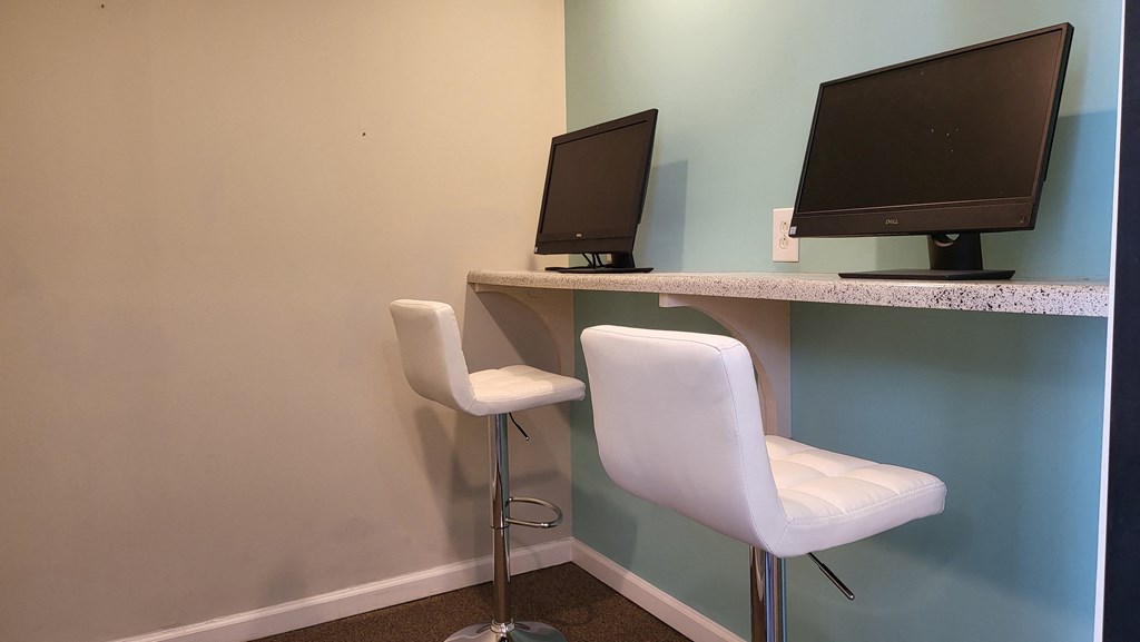 Desk with 2 monitors and chairs at Willow Apartments, Nashville, TN, 37217