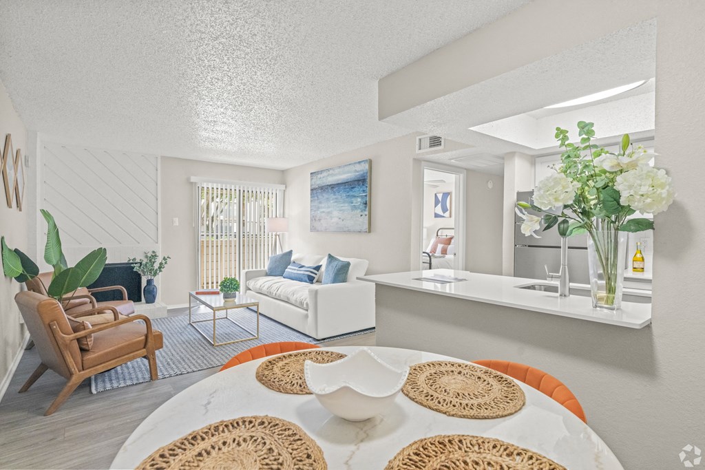 a living room and dining room with a table and chairs at District 2308, Arlington Texas?