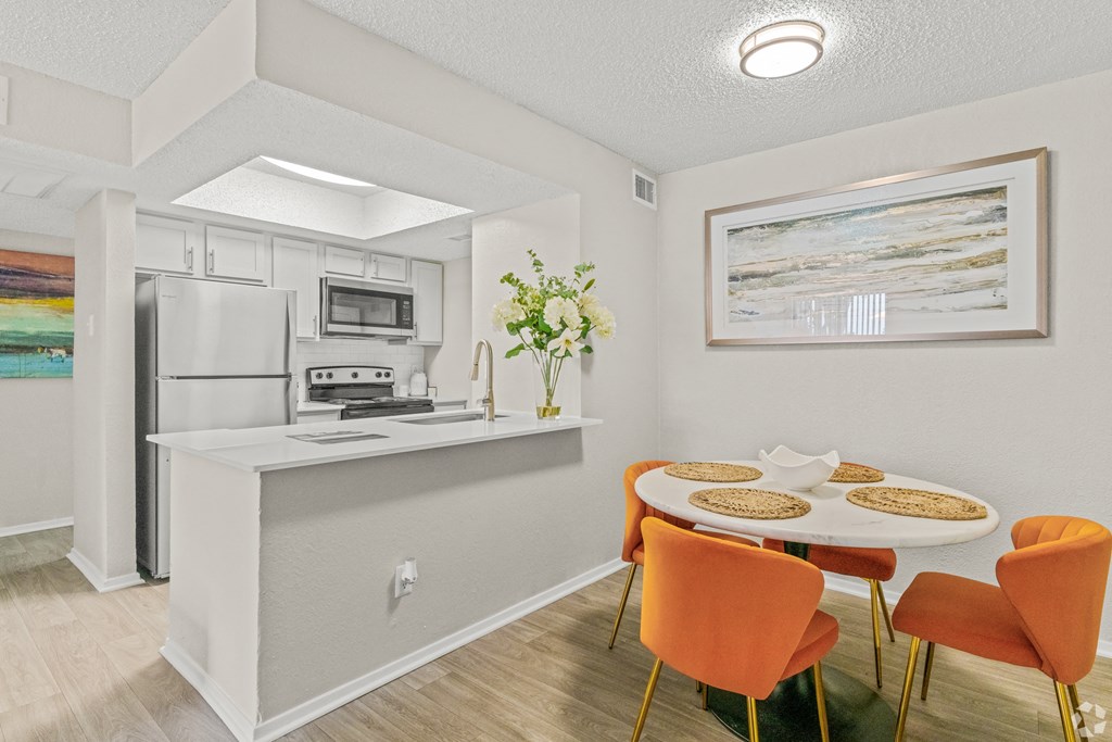 a dining room and kitchen with a table and chairs at District 2308, Arlington, 76011 ?