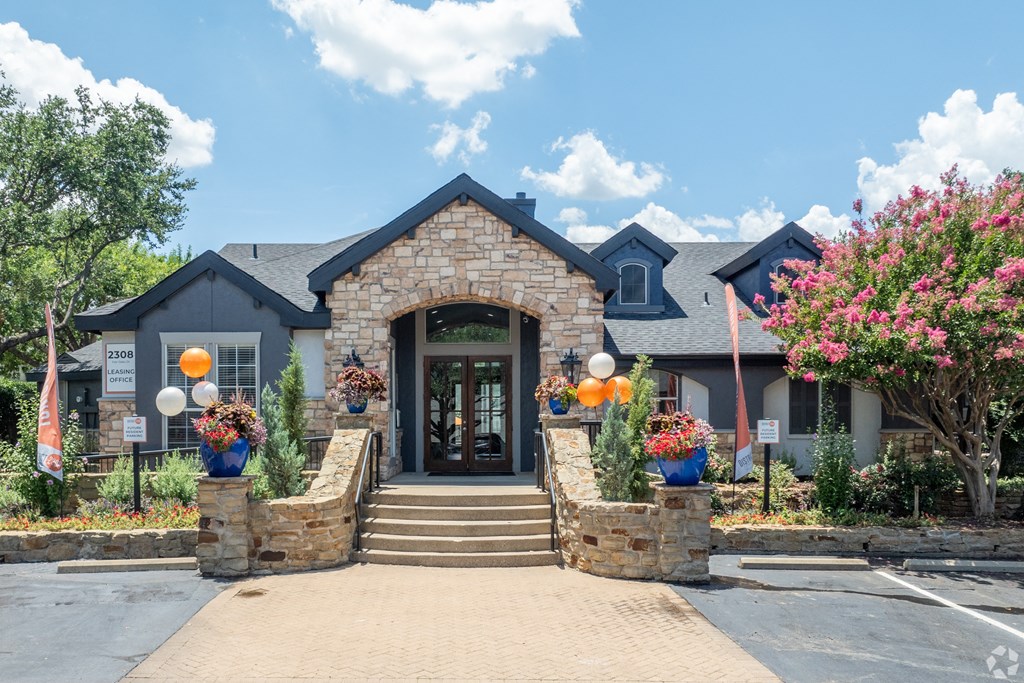 the front entrance of the clubhouse at the preserve at gardner park apartments at District 2308, Arlington, TX ?