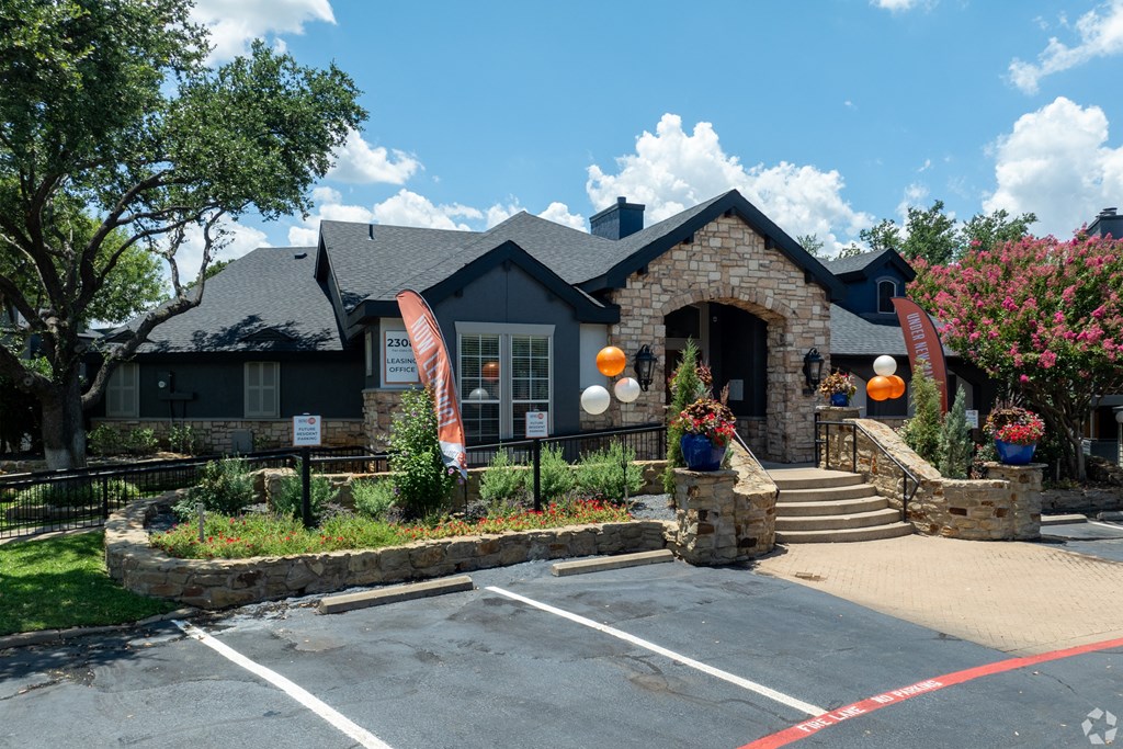 the front of a house with pumpkins on the front yard at District 2308, Arlington ?
