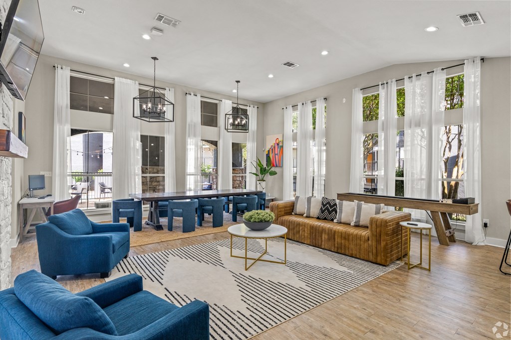 a living room with couches and chairs and a table at District 2308, Texas ?
