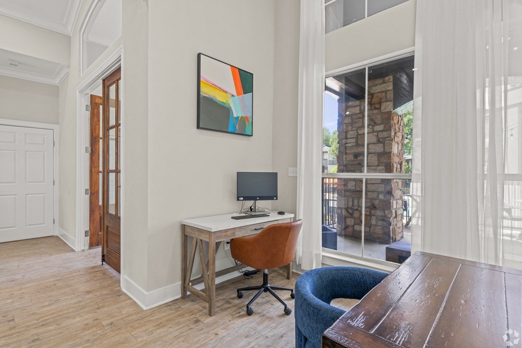 a home office with a desk and a window at District 2308, Texas, 76011