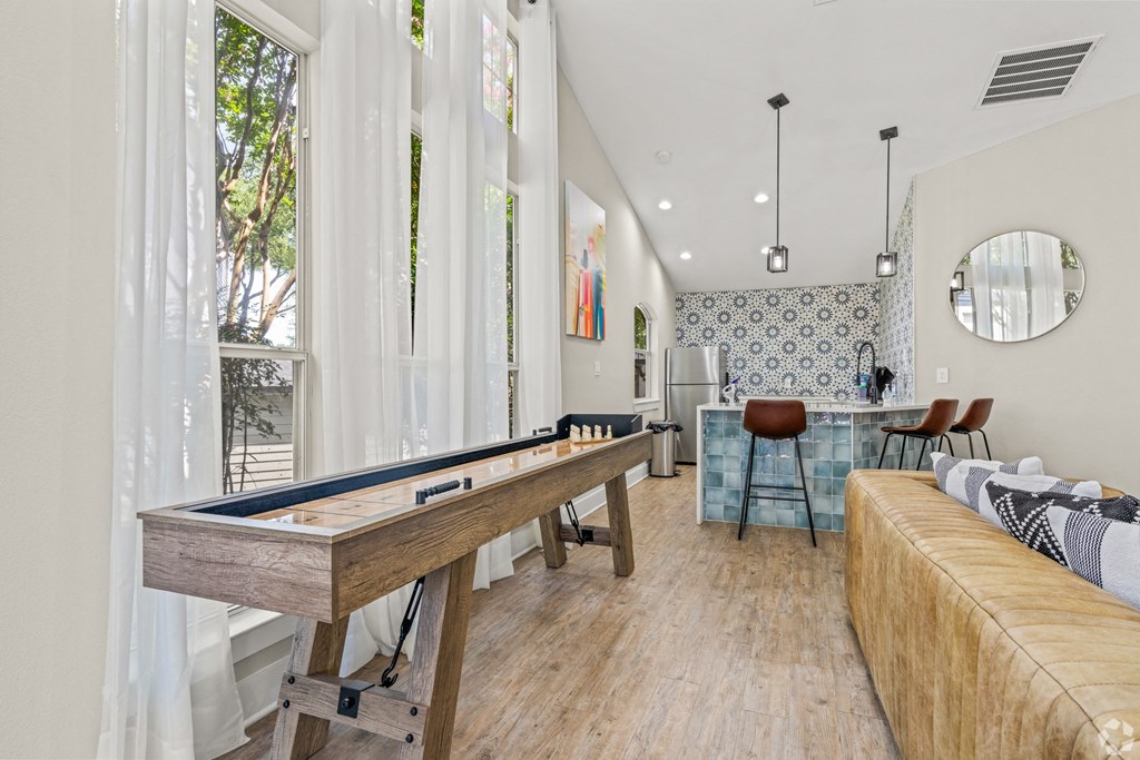 a game room with a pool table and a bar at District 2308, Texas ?