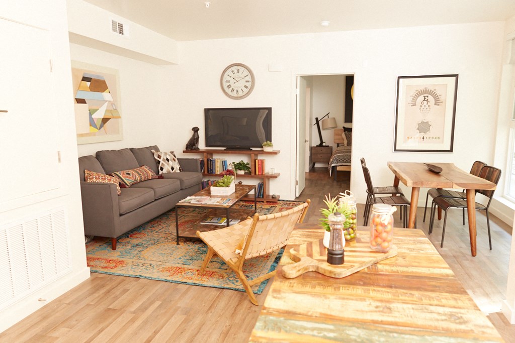 a living room with a couch and a table and a television