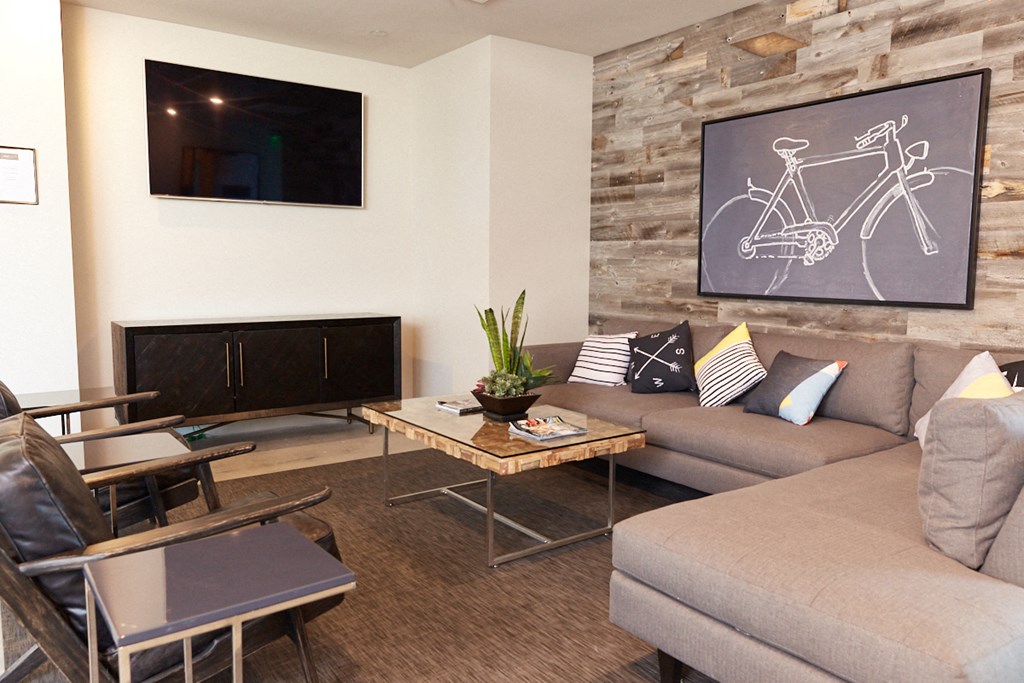 a living room with a couch and a table and a television