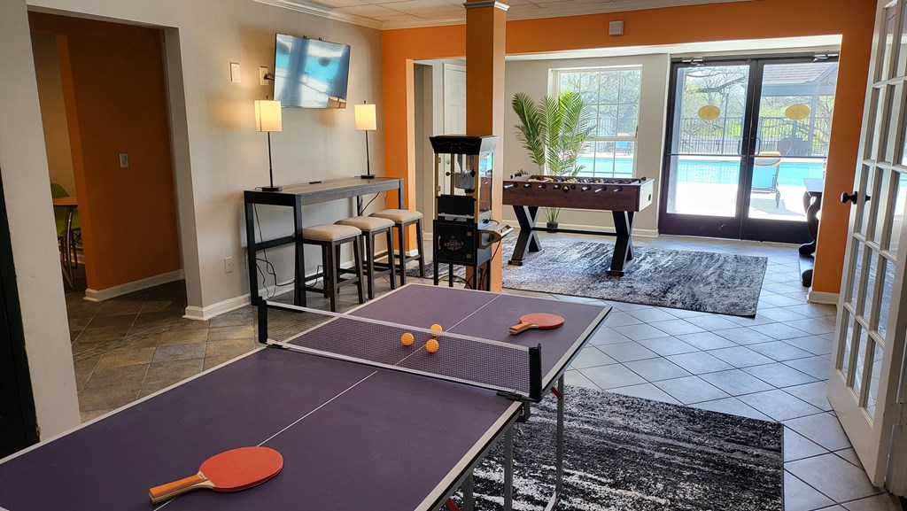 Game room with a ping pong table at Willow Apartments, Nashville, Tennessee