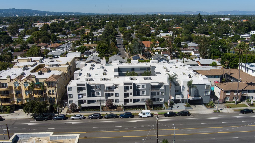 an aerial view of a large building on a city street