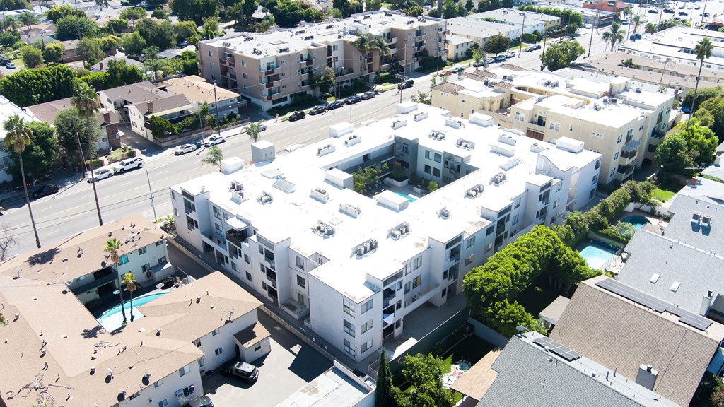 an aerial view of an apartment building in a city