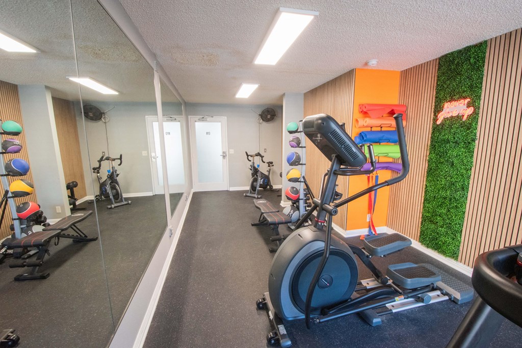 fitness center with cardio equipment