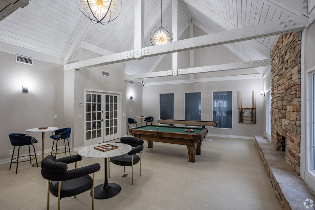 A room with a pool table and a billiard table. at The Grove Brentwood, Nashville, TN 37211 