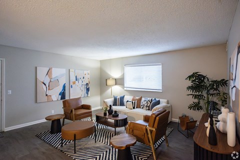 A living room with a couch, chairs, and a coffee table. at The Grove Brentwood, Nashville, TN 37211 