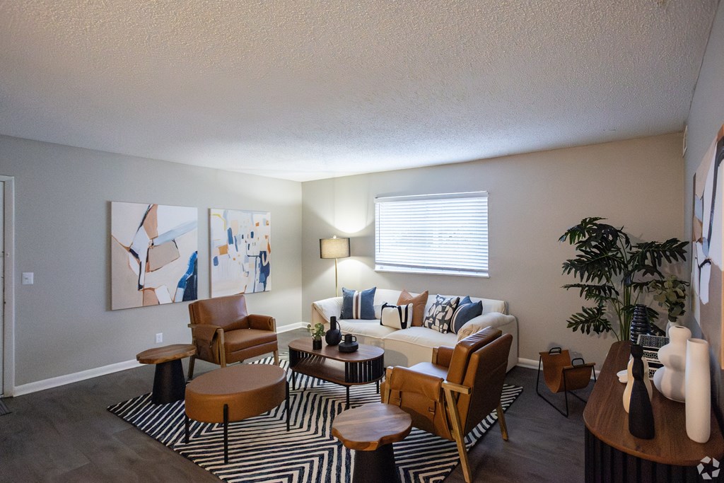 A living room A living room with a couch, chairs, and a coffee table. at The Grove Brentwood, Nashville, TN 37211