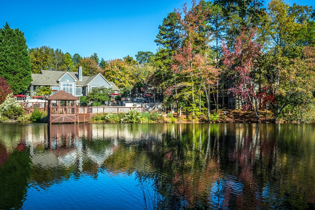 a view of a lake with a house in the background