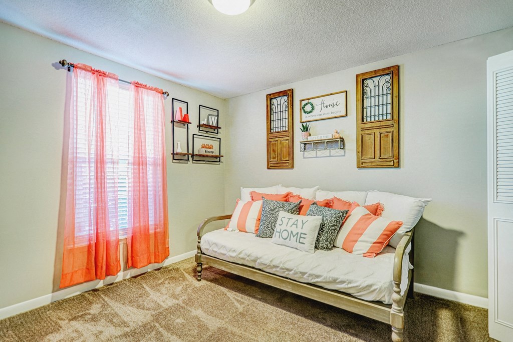 bedroom with futon and window