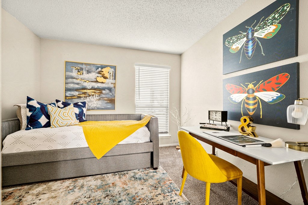 a bedroom with a bed and a desk with a computer at Keller Oaks, Carrollton Texas?