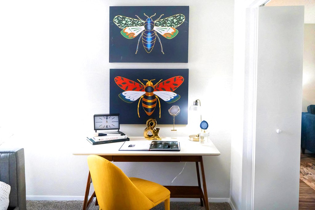 a home office with a desk and two paintings of bees and flies at Keller Oaks, Carrollton, 75006 ?