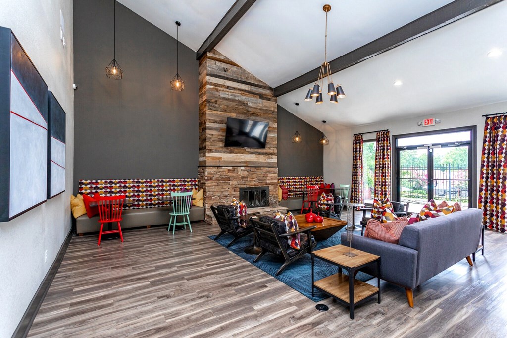 the reserve at city center spacious living room with fireplace and tv