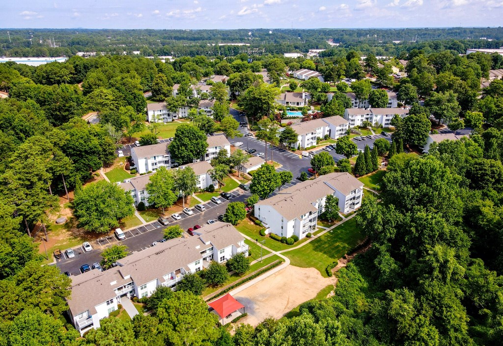 an aerial view of a neighborhood with houses and trees