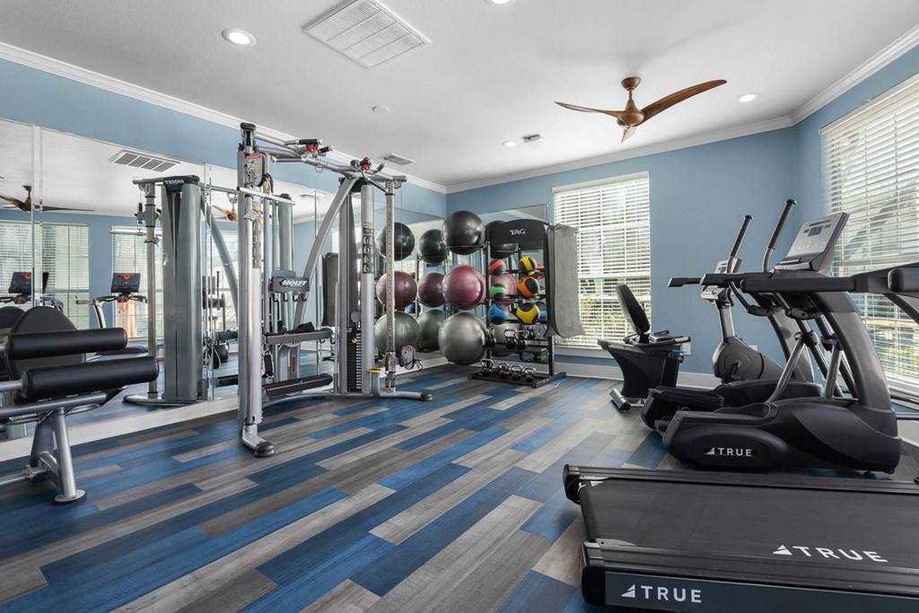 the gym is stocked with weights and cardio equipment at District 2308, Arlington, TX ?