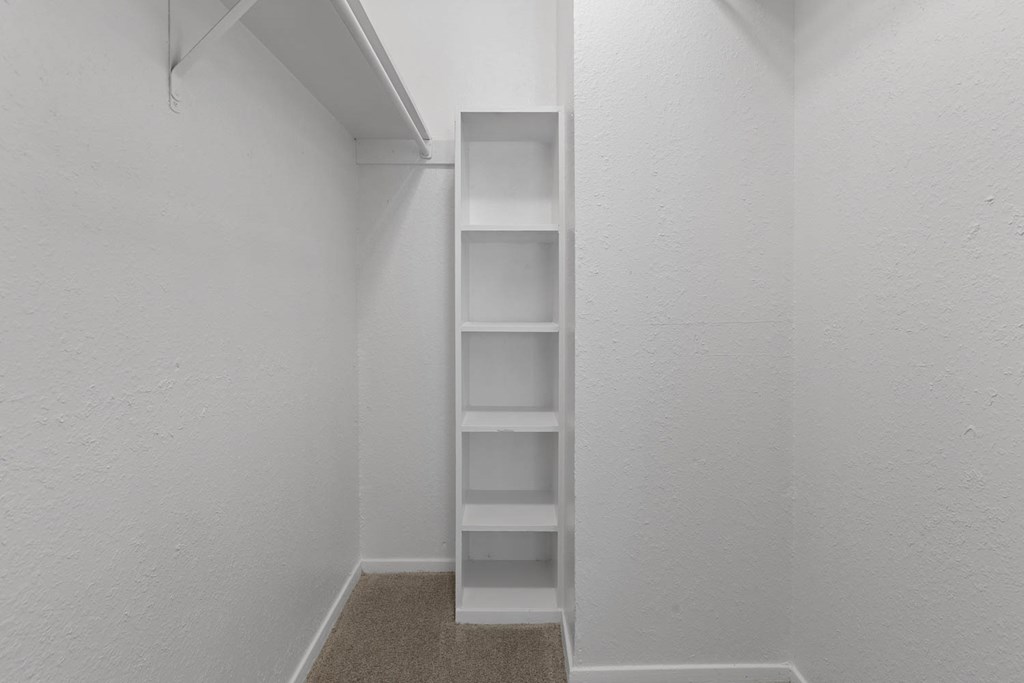 the closet in a small apartment with shelves and a window at District 2308, Arlington Texas?
