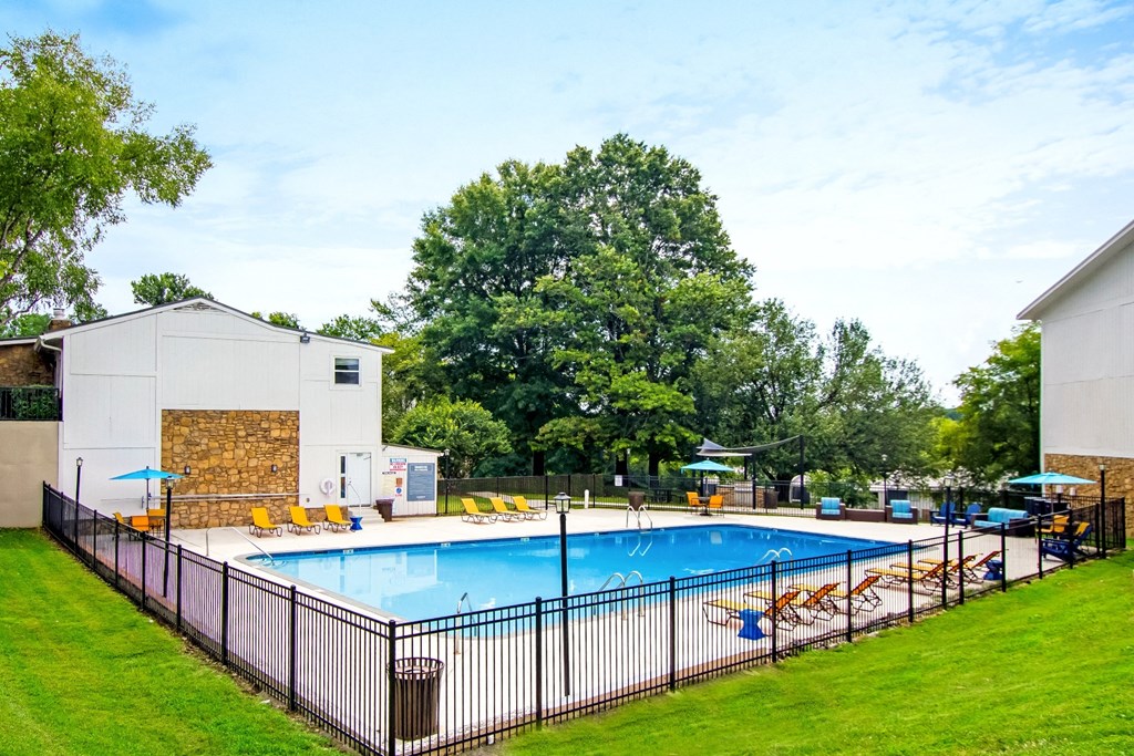 our resort style swimming pool is next to our building and our hotel with lounge chairs