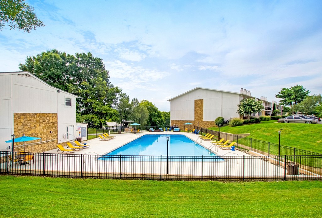 the preserve at ballantyne commons pool and buildings with grass and trees