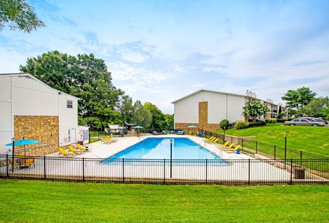 the preserve at ballantyne commons pool and buildings with grass and trees