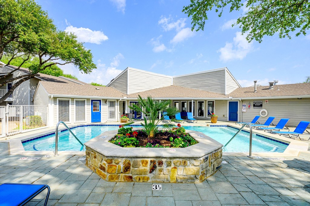 the preserve at ballantyne commons pool party area with chairs and a swimming pool