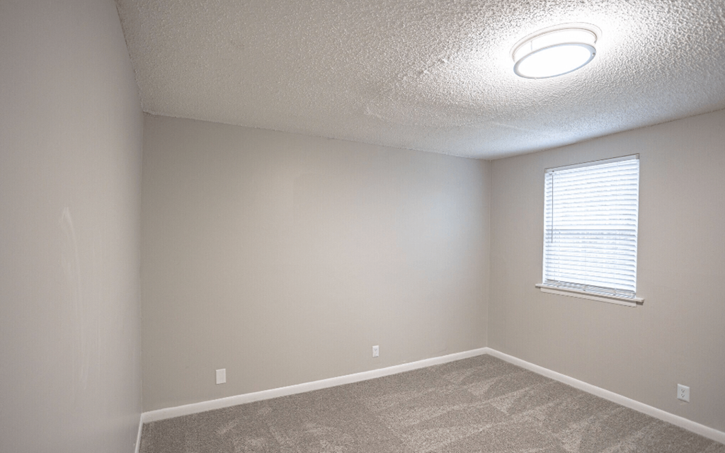 Bedroom with carpet and a window at Willow Apartments, Nashville